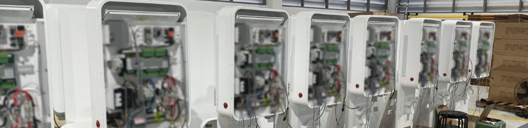 EV charging electrical control cabinets in a workshop