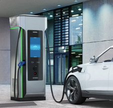 EV charging station connected to a white electric car